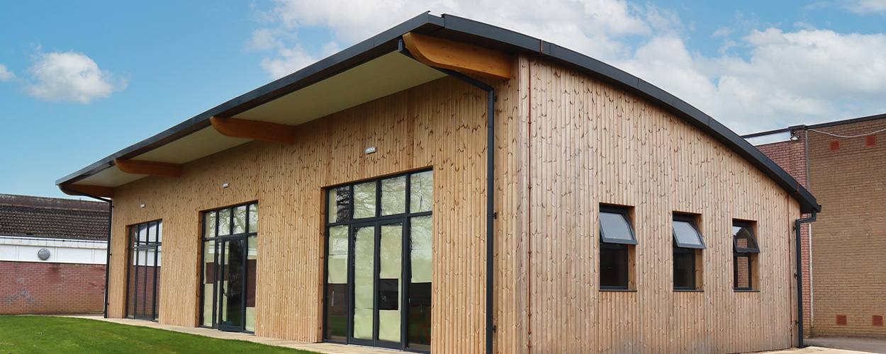 Photo of one of Fordingbridge's canopies for schools with a timber frame.