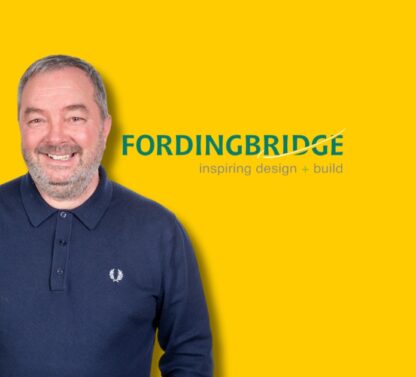 Picture shows Chris on a Yellow background
