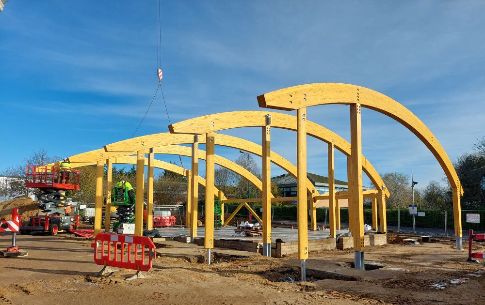 Picture shows timber frame structure going up at Norwich Costa