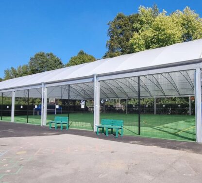 Picture shows a covered MUGA area at a school