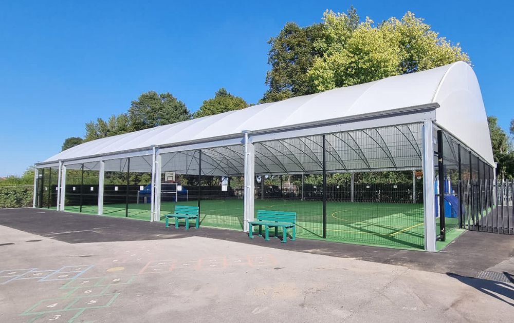 Picture shows a covered MUGA area at a school