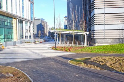Picture shows the sleek look of the bike shelters was softened with green sedum roofs that not only provide a more attractive look but that also encourage biodiversity across the campus.