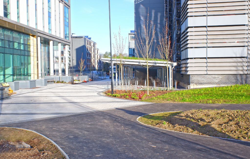 Picture shows the sleek look of the bike shelters was softened with green sedum roofs that not only provide a more attractive look but that also encourage biodiversity across the campus.