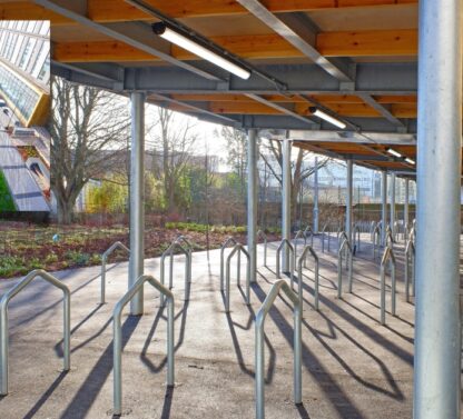 Picture show green bike shelter at the University of Cambridge biomedical campus