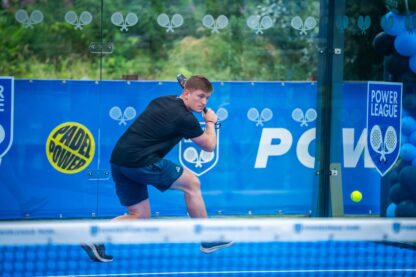 Picture shows player about to hit a ball in the new padel court at Powerleague Paisley Padel