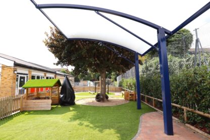 Bespoke cantilever canopy positioned along the perimeter fence to keep SEND outdoor play space open and obstacle free
