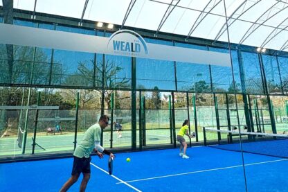 Players enjoying padel under twin span canopy at The Weald Racquets Club in Sussex