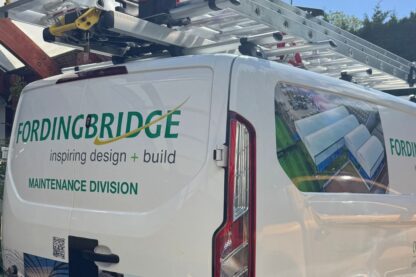 Fordingbridge Maintenance Division van with branded livery and roof-mounted ladders, showcasing the company’s canopy maintenance service and aerial image of large covered structures on a bright sunny day.