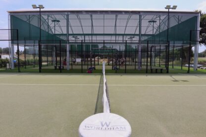 Covered padel courts at Worldham Golf & Padel in Hampshire, featuring an all-weather canopy with green mesh surrounds.