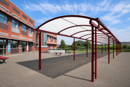 Covered school walkway at Dean Trust Wigan, providing an all-weather route between buildings and additional sheltered space for students.