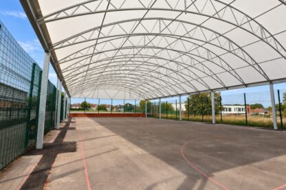 Covered MUGA at Prenton High School in Birkenhead, providing a sheltered all-weather sports court for year-round school activities.